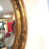 Miroir ovale en bois doré 98x63 cm