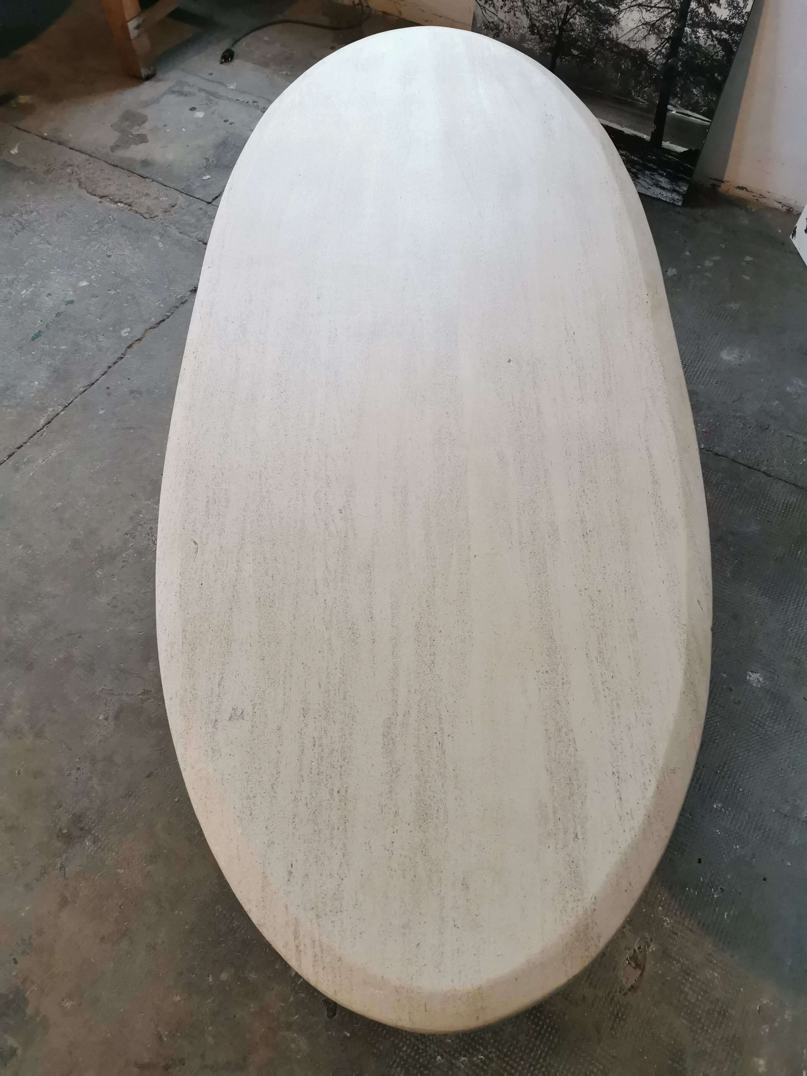 Large oval coffee table in travertine and metal