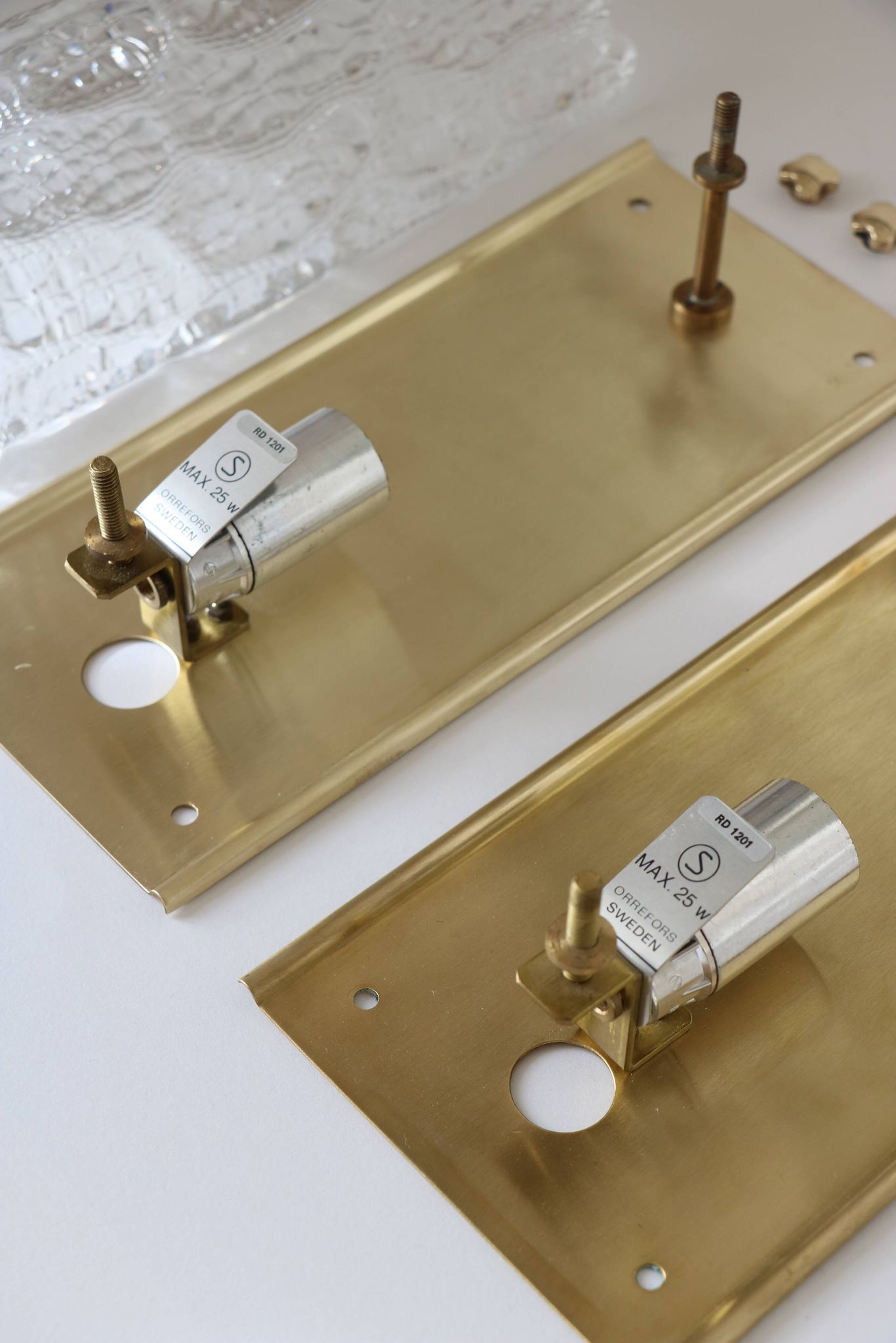 Pair of glass and brass wall lights by Carl Fagerlund for Orrefors, 1960.