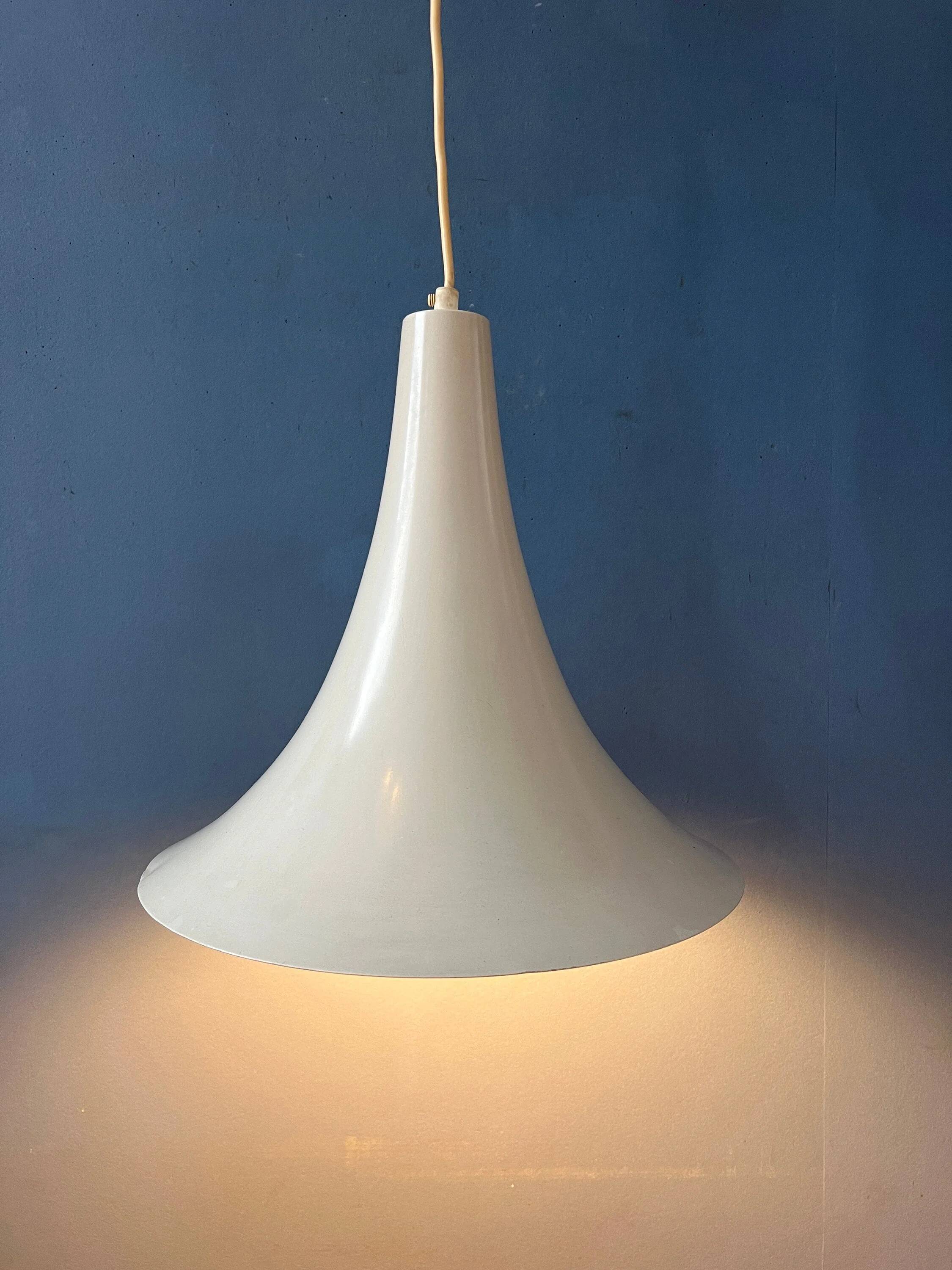 Small vintage beige pendant light in the shape of a witch's hat.
