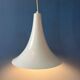 Small vintage beige pendant light in the shape of a witch's hat.