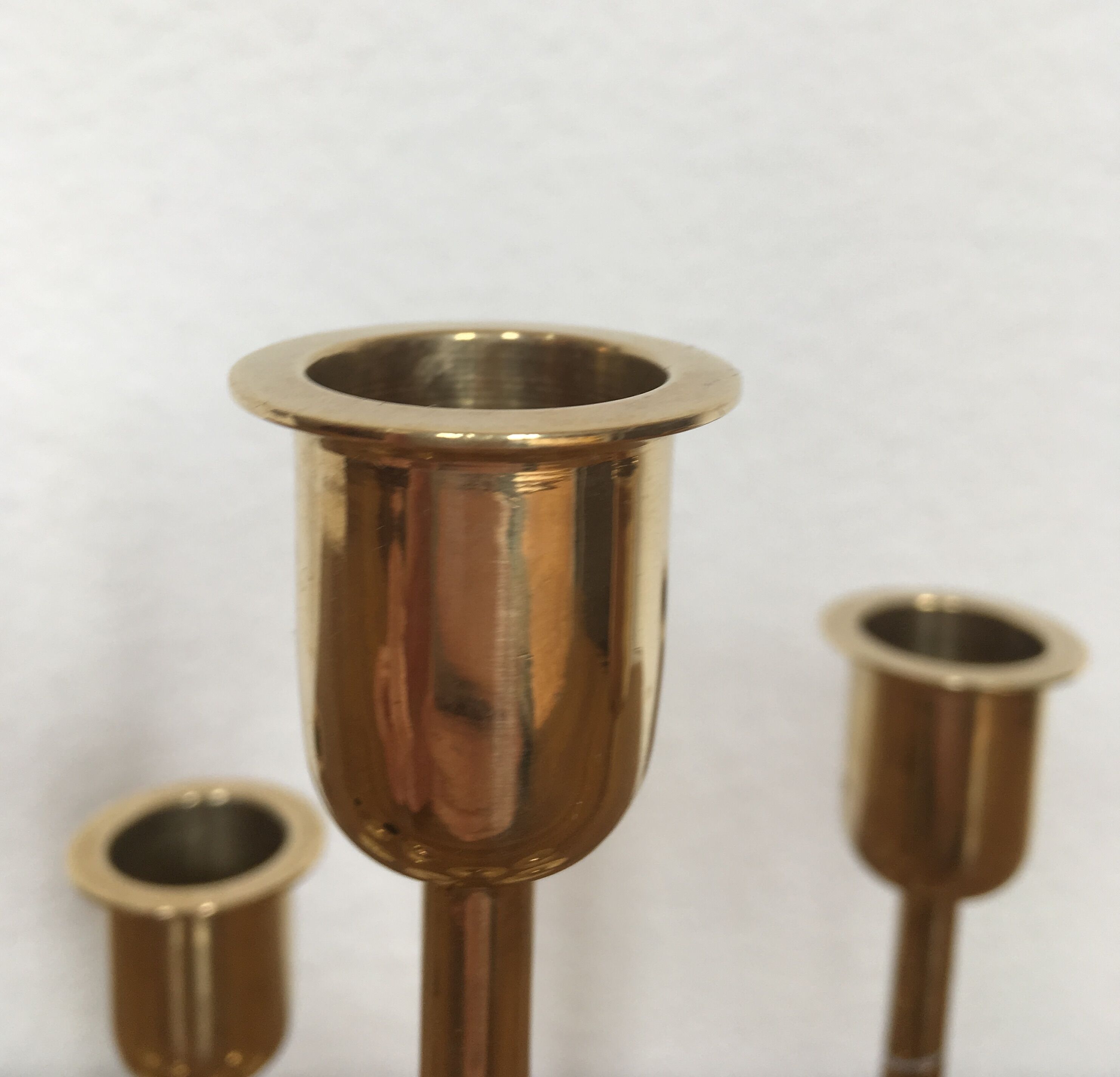 Series of 7 Scandinavian brass candlesticks