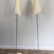 Pair of designer parquet floor lamps composed of lacquered metal and chrome bases and designer white plastic lampshades