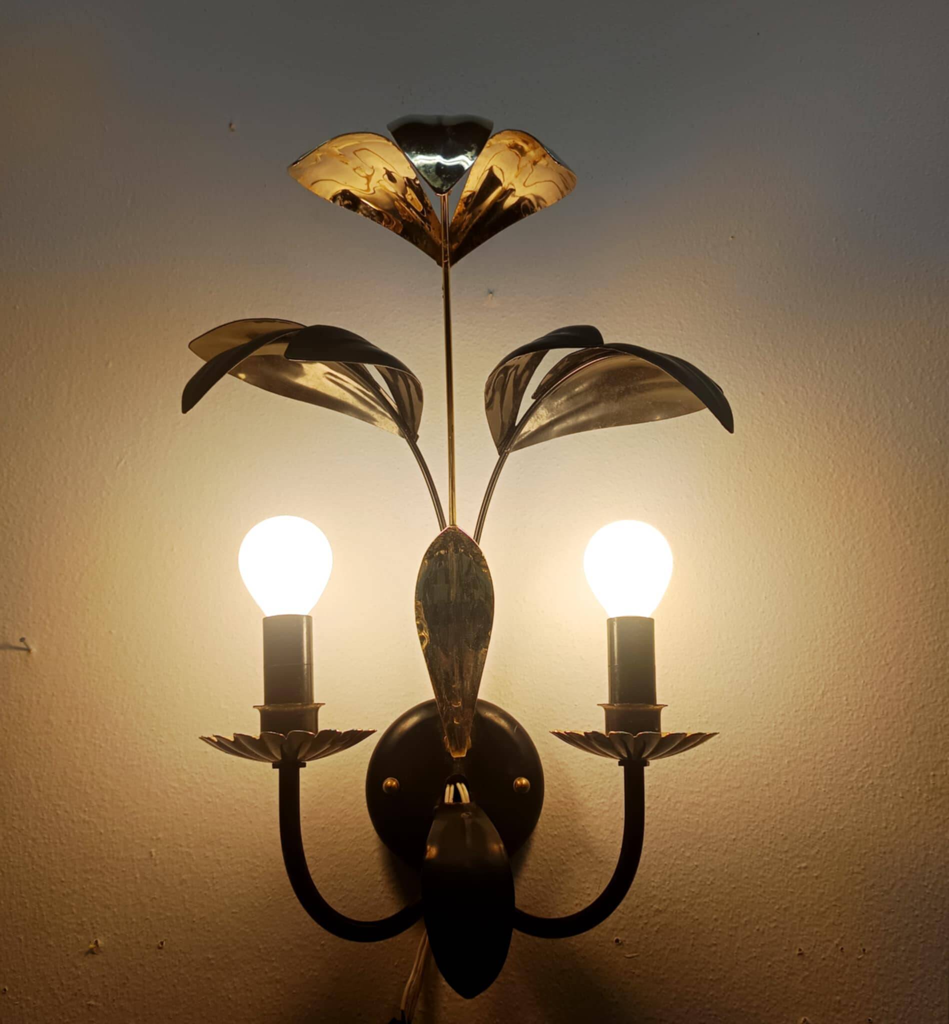 Black and gold Hollywood Regency leaf wall sconce