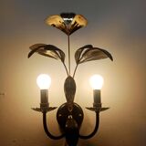 Black and gold Hollywood Regency leaf wall sconce