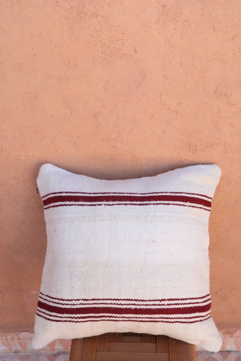 burgundy and white striped cushion in handmade wool