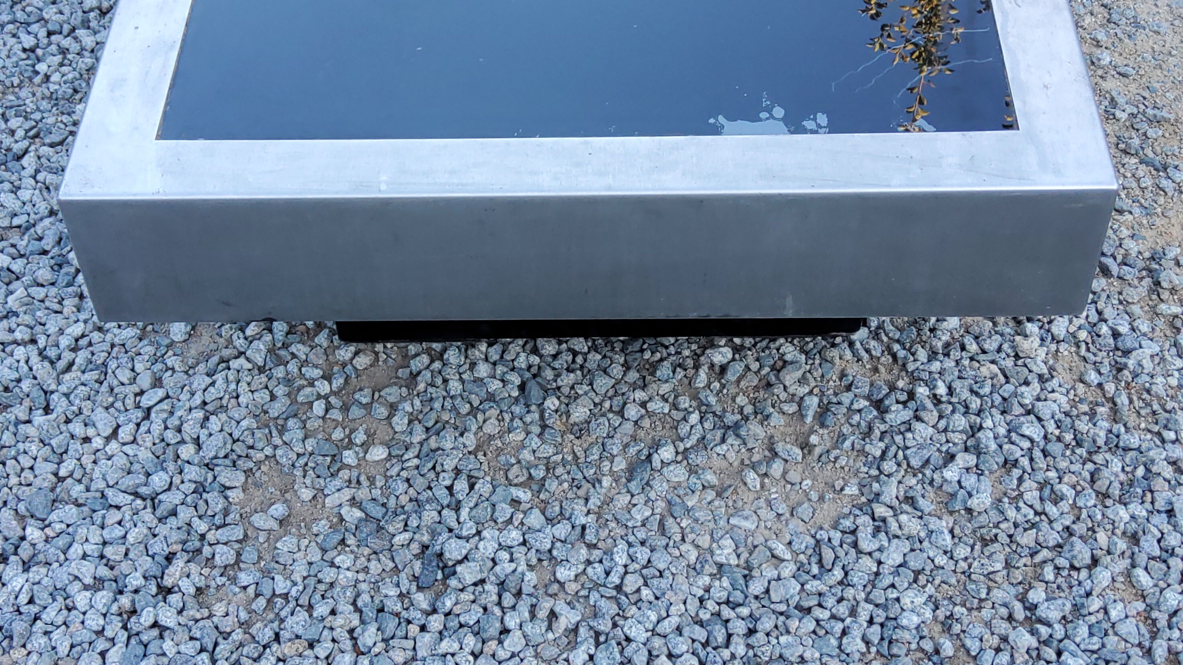 Coffee table in brushed steel and black tinted glass from the 70s