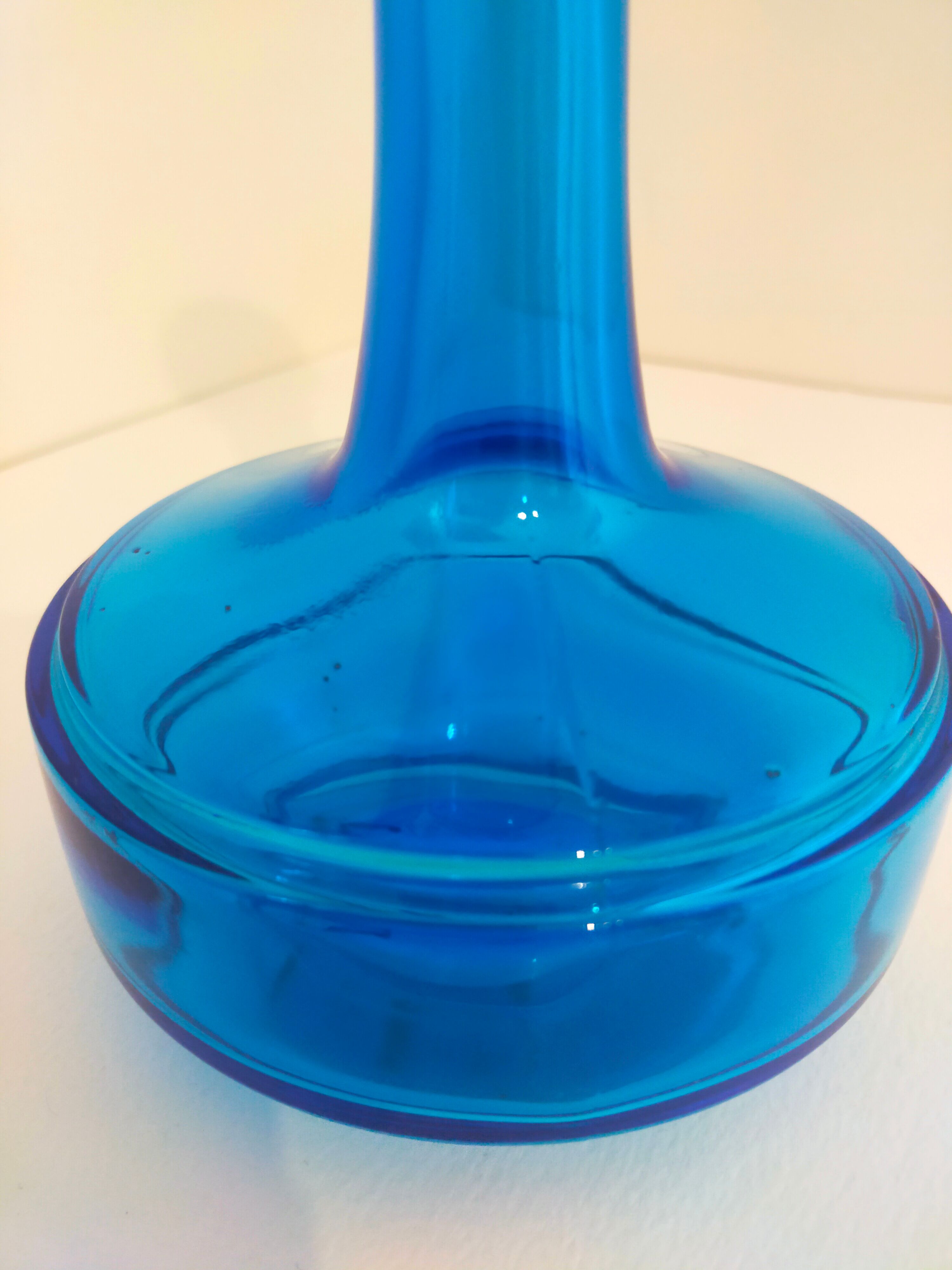 Bottle of old perfume of blue color