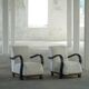 A pair of Swedish Art Deco lounge chairs with curved armrests, 1930s.