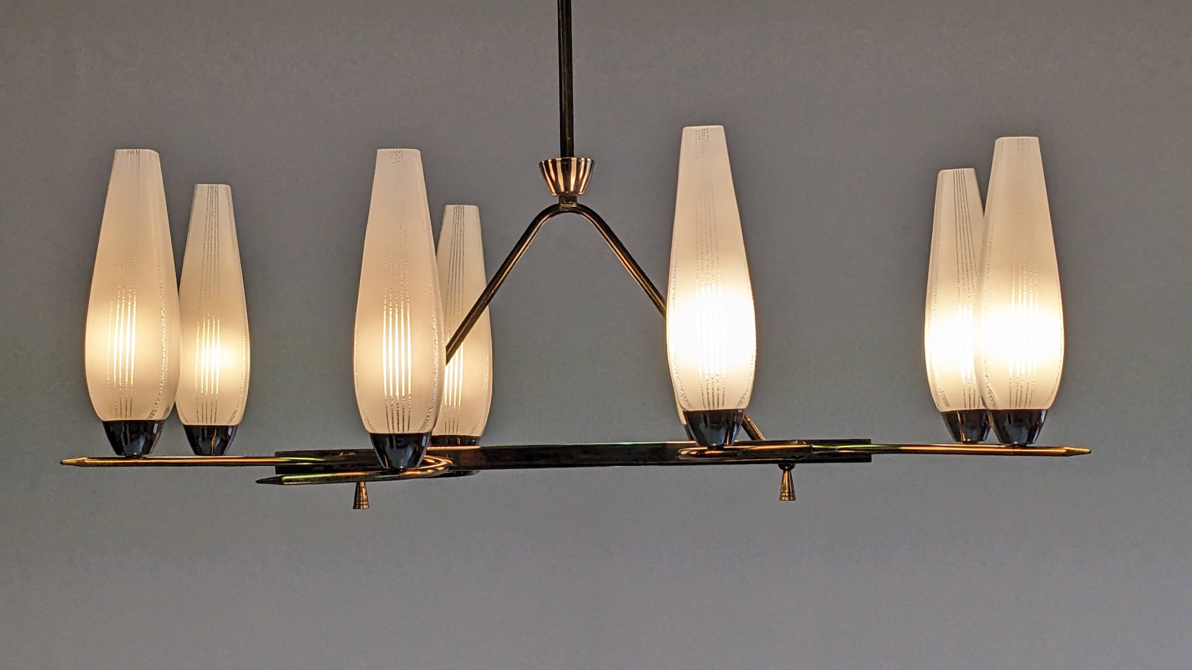 Eight-light chandelier in glass and brass, France circa 1960.