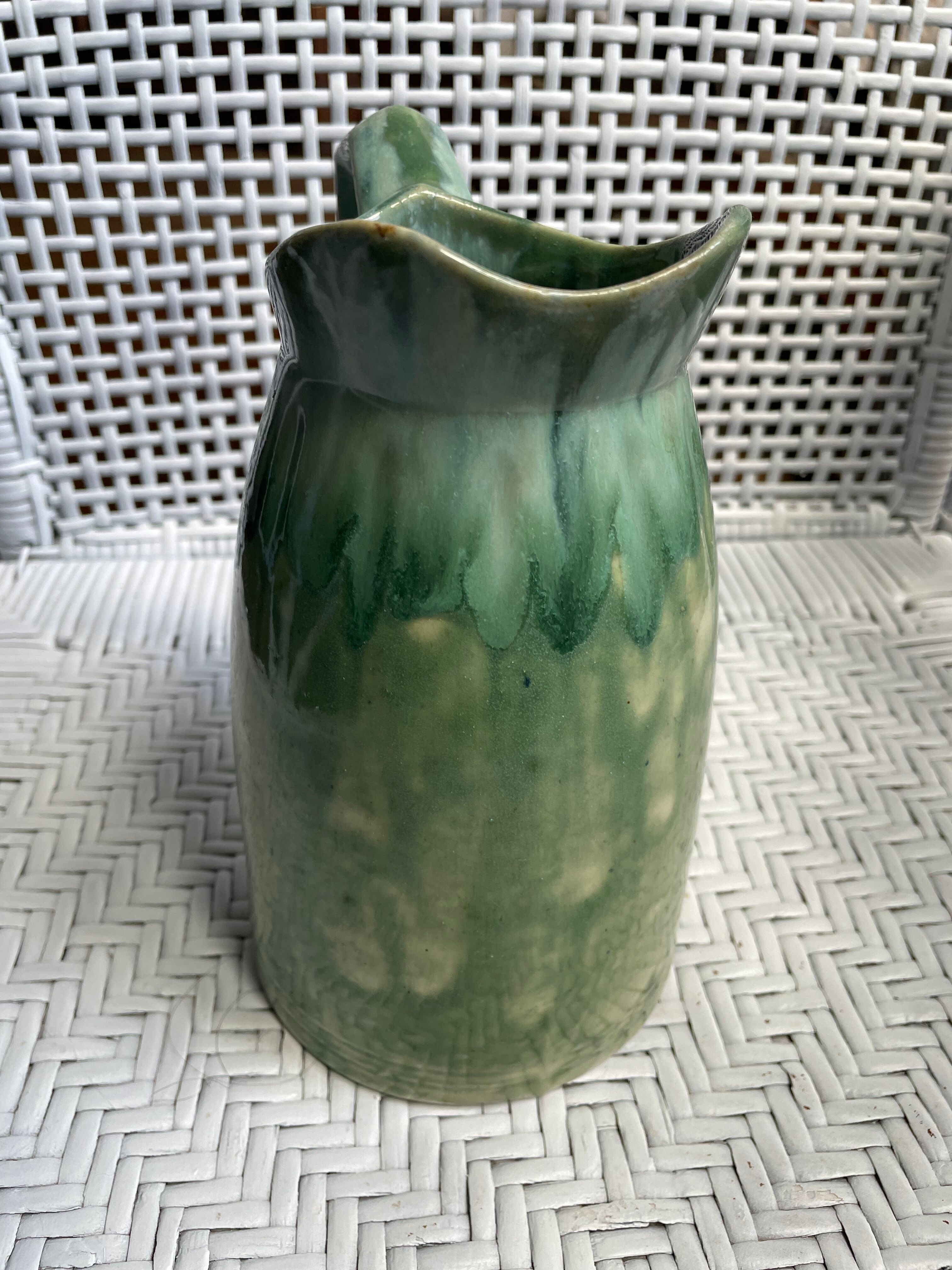 Turquoise green enamelled ceramic pitcher