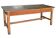 Large industrial workshop table in brown wood, wide top and sturdy vintage legs.
