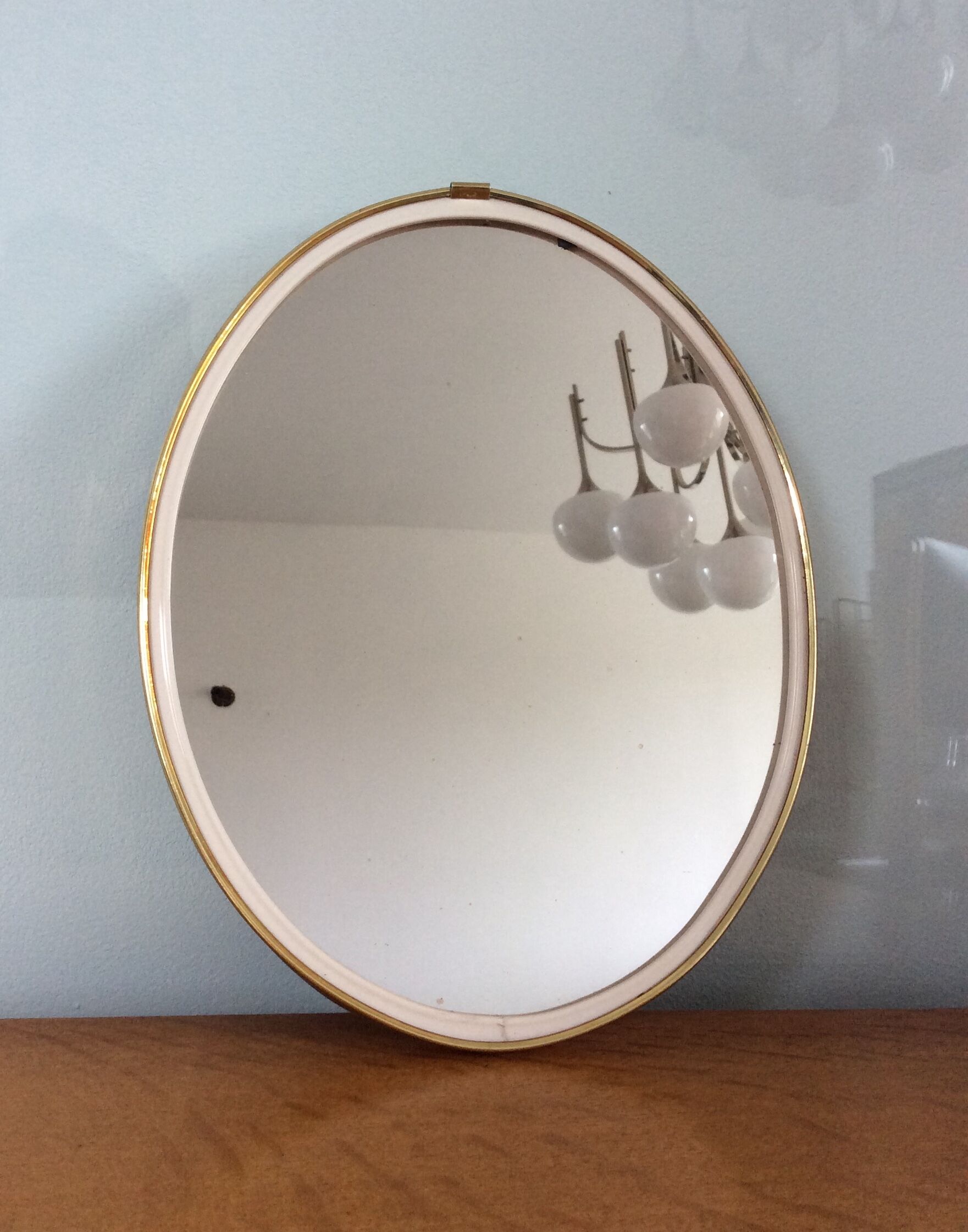 Free-form oval sheathed mirror from the 60s and 70s