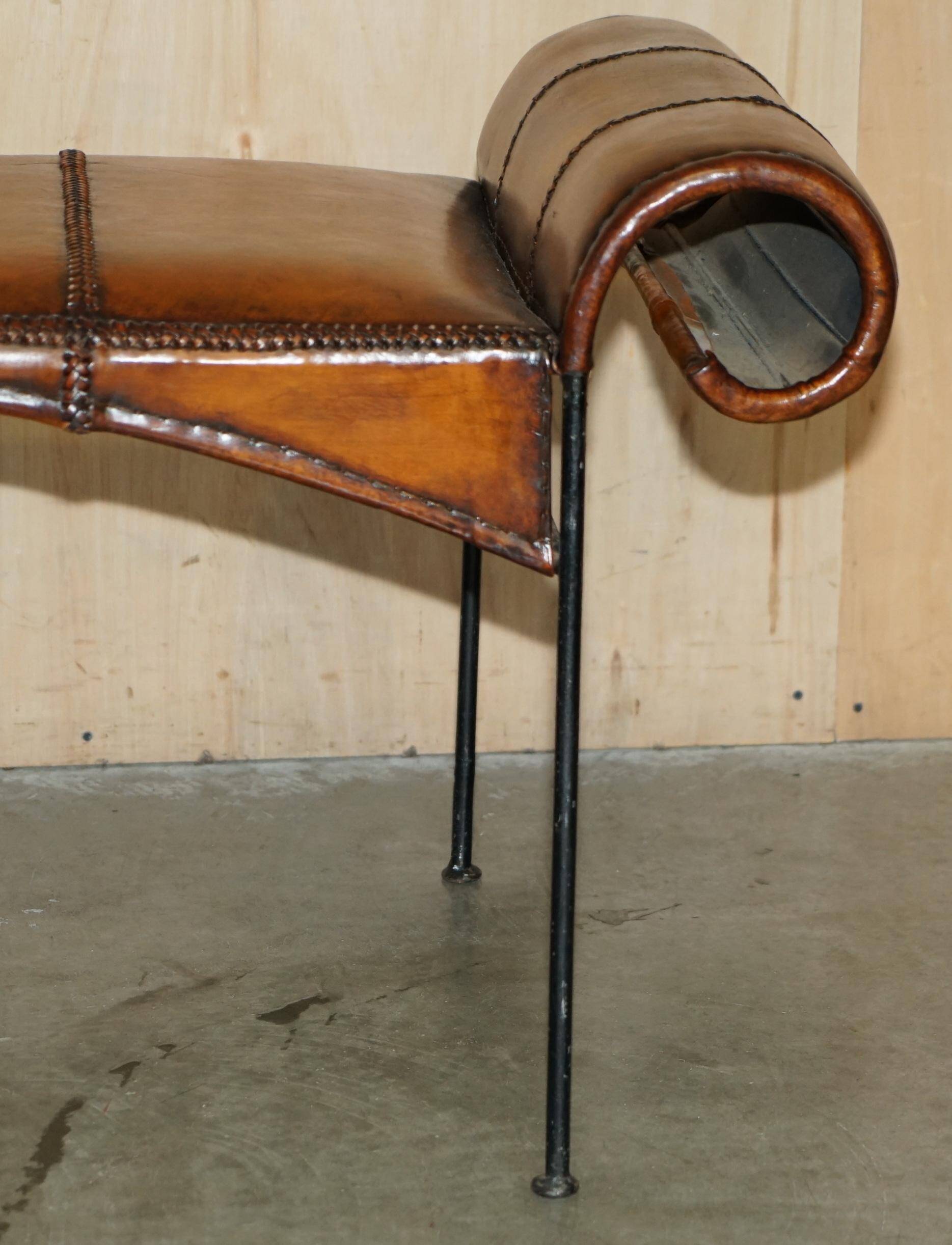 Vintage Spanish window bench in hand-stitched leather and restored iron.