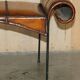 Vintage Spanish window bench in hand-stitched leather and restored iron.