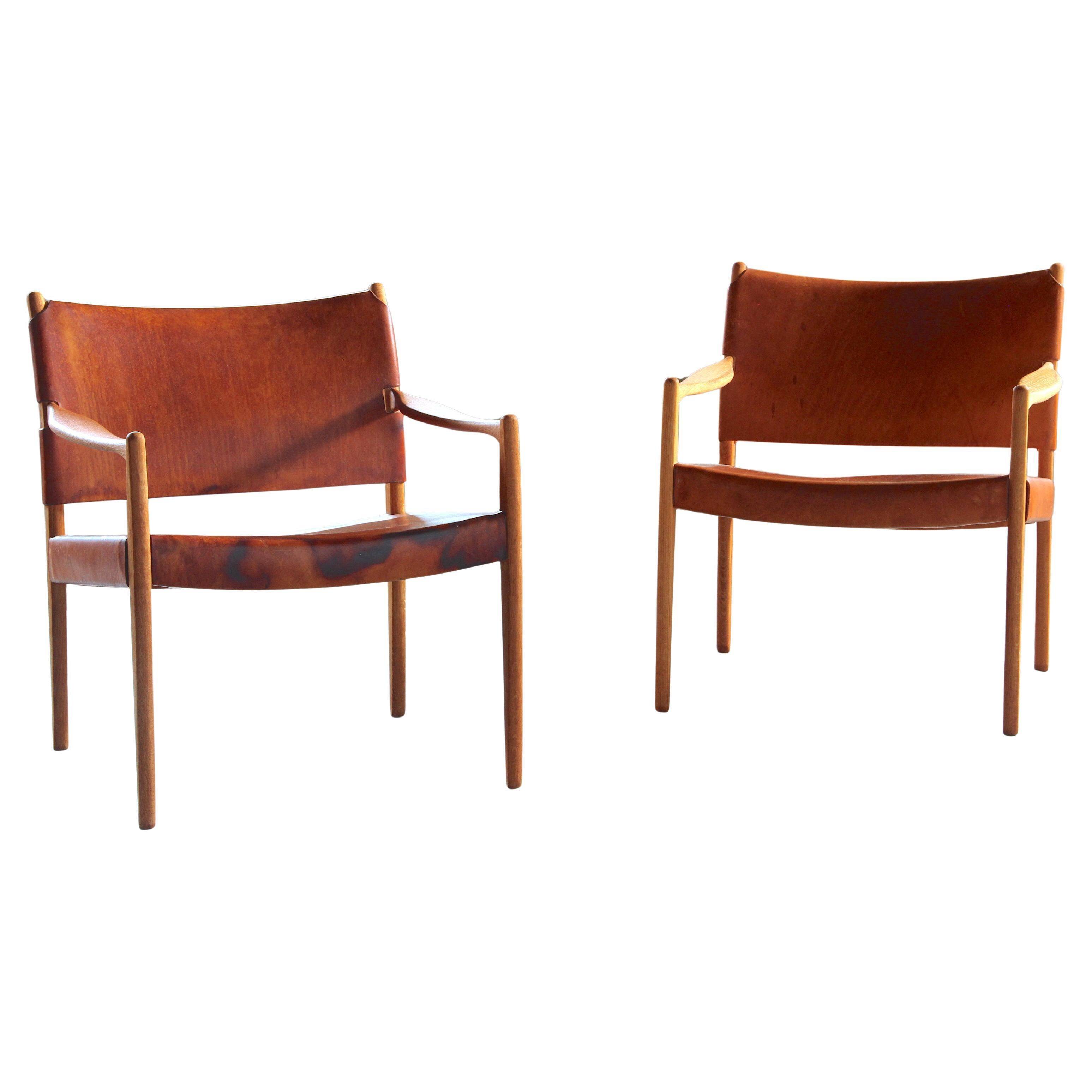 Pair of vintage Per-Olof Scotte "Premier 69" oak armchairs in cognac leather