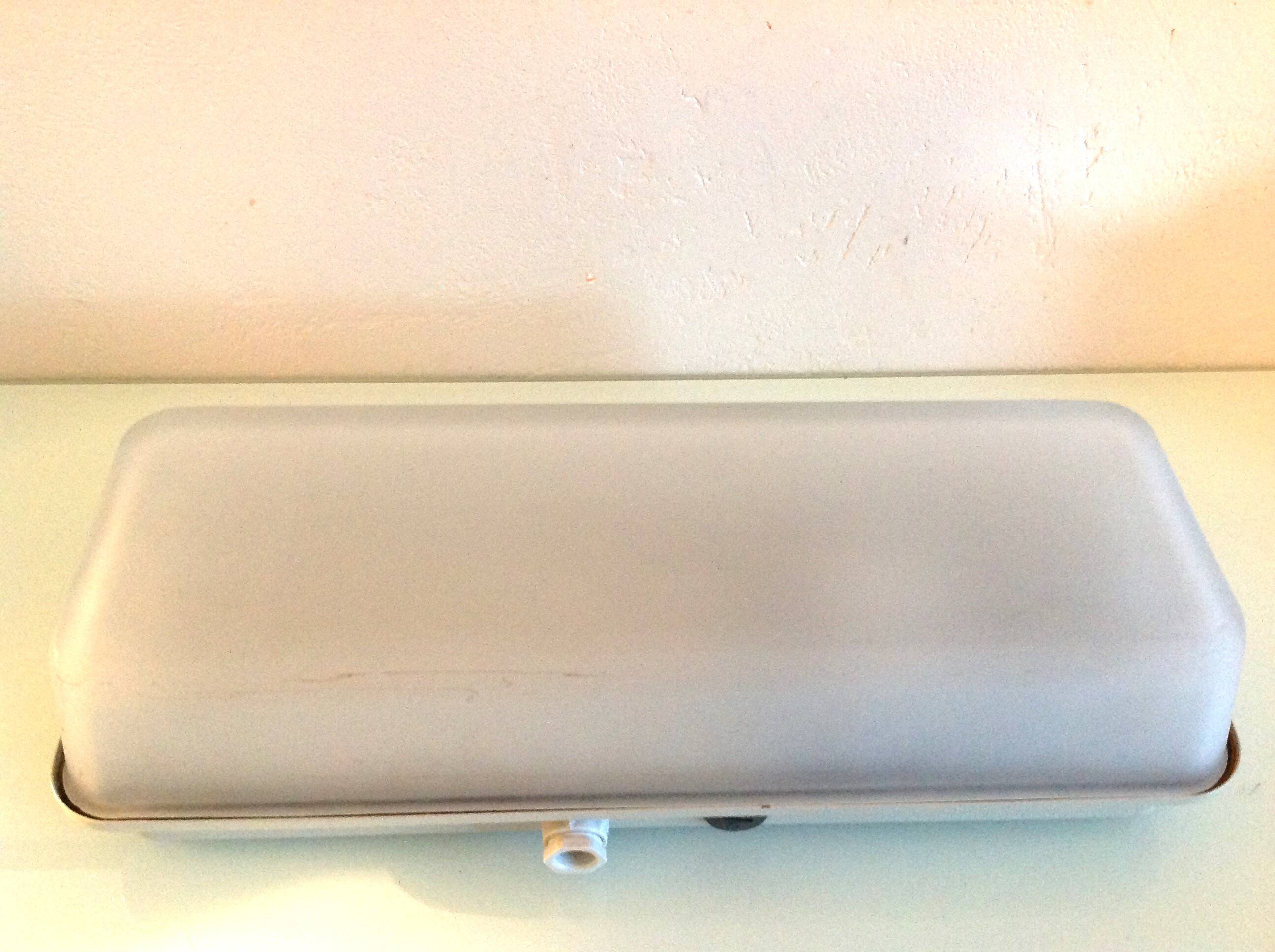 Rectangular porthole wall light in industrial/70s style frosted glass