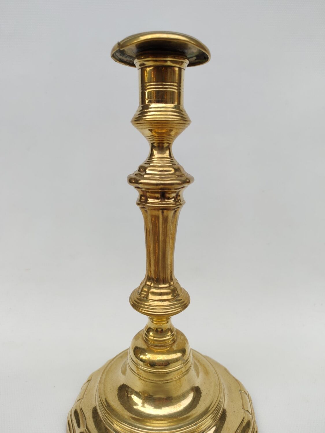 Pair of solid brass candlesticks, early 18th century.