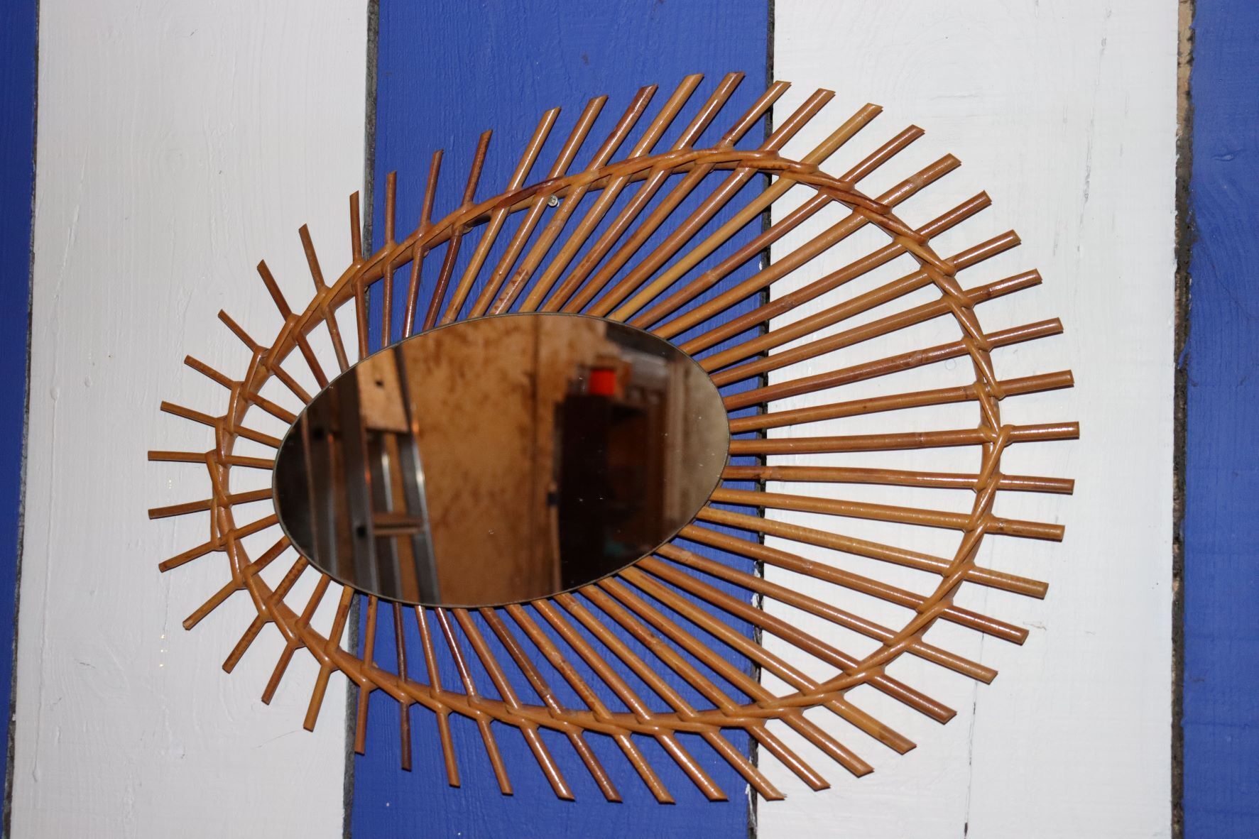 Oval rattan mirror