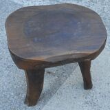 three-legged milking stool made of olive tree folk art