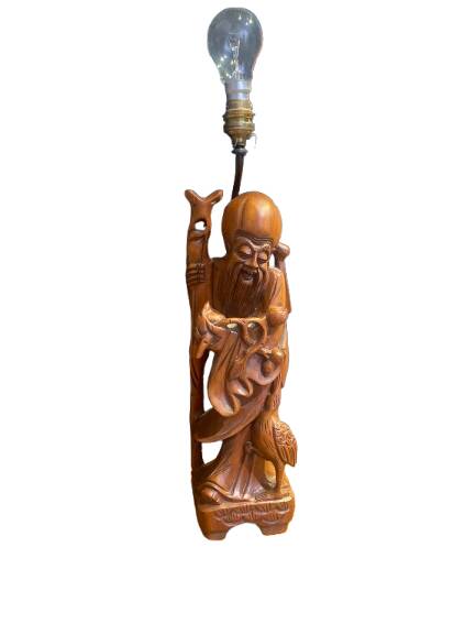 Carved wooden table lamp representing a man