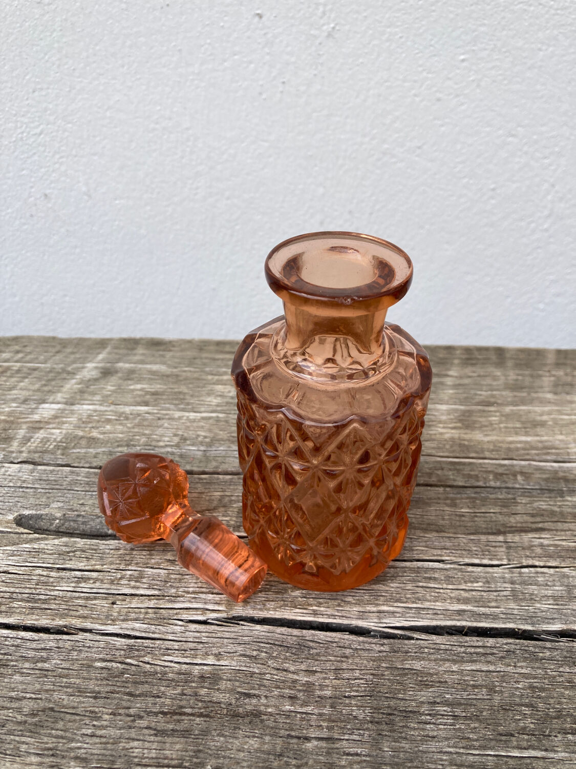 Art Deco perfume bottle in old amber pink glass