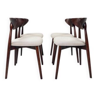 Set of 8 dining chairs in a heritage herringbone pattern.