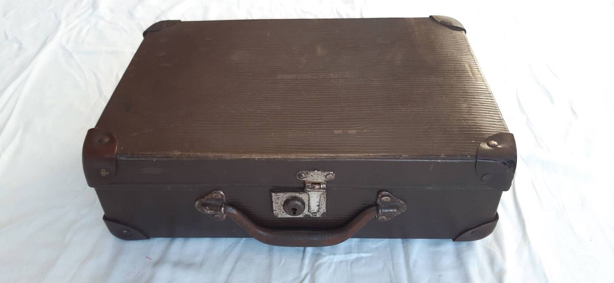 Small old suitcase with a ribbed appearance
