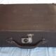 Small old suitcase with a ribbed appearance