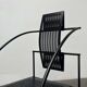 Postmodern black Quinta chair in perforated metal by Mario Botta for Alias, 1980s.