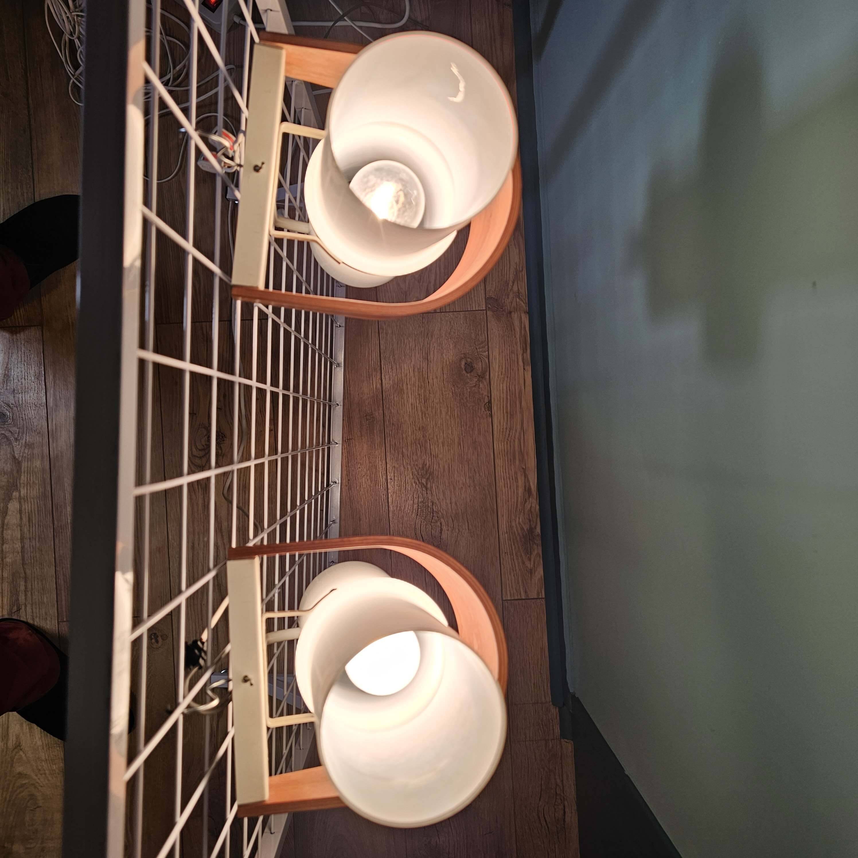 Louis kalff (1897-1976) for philips, pair of nx40 wall lights in wood, opaline glass, and lacquered metal,