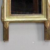 Miroir en bois doré, style Louis XVl, début XXe
