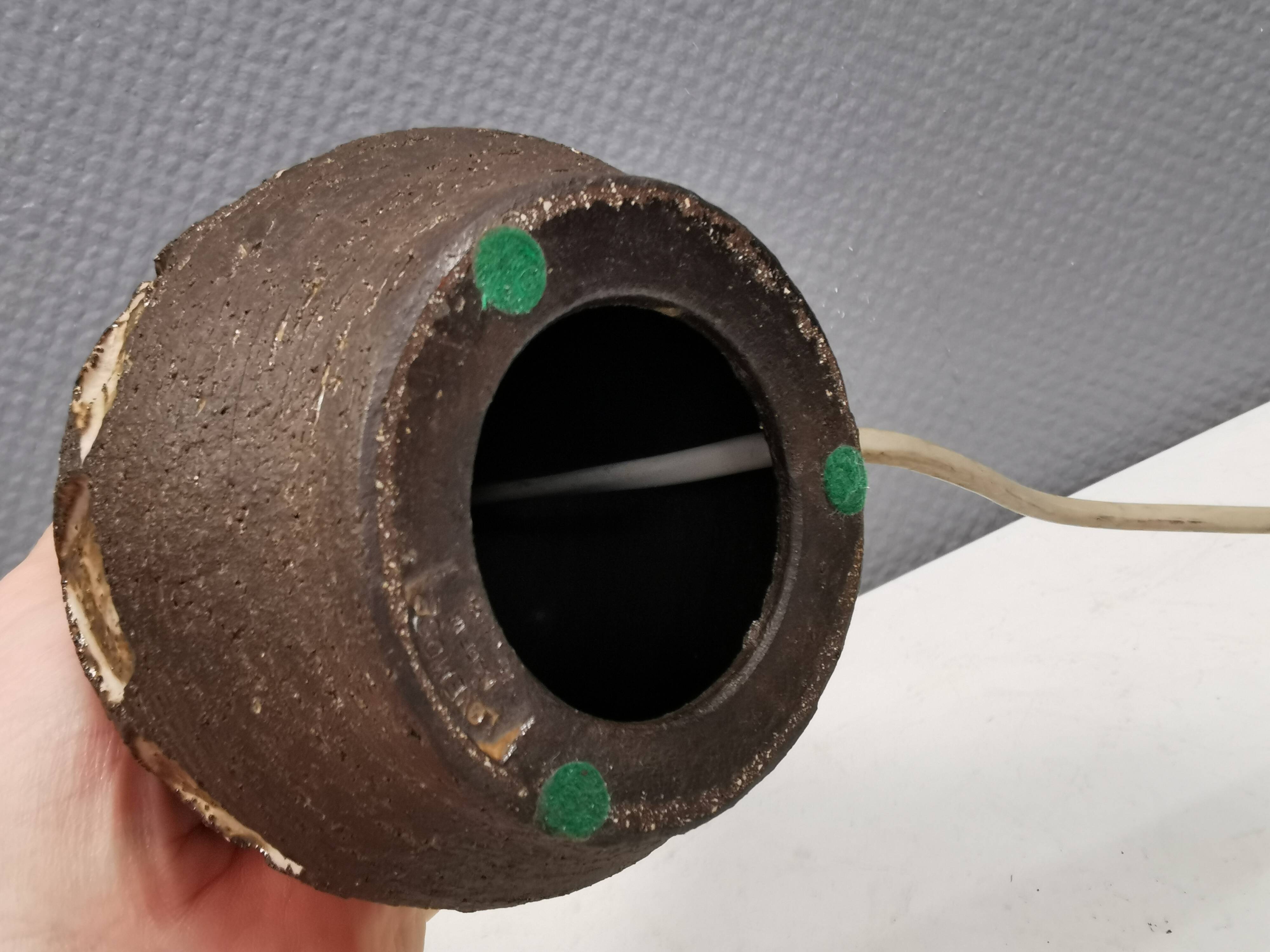 Small beautiful ceramic table lamp in earth colors.