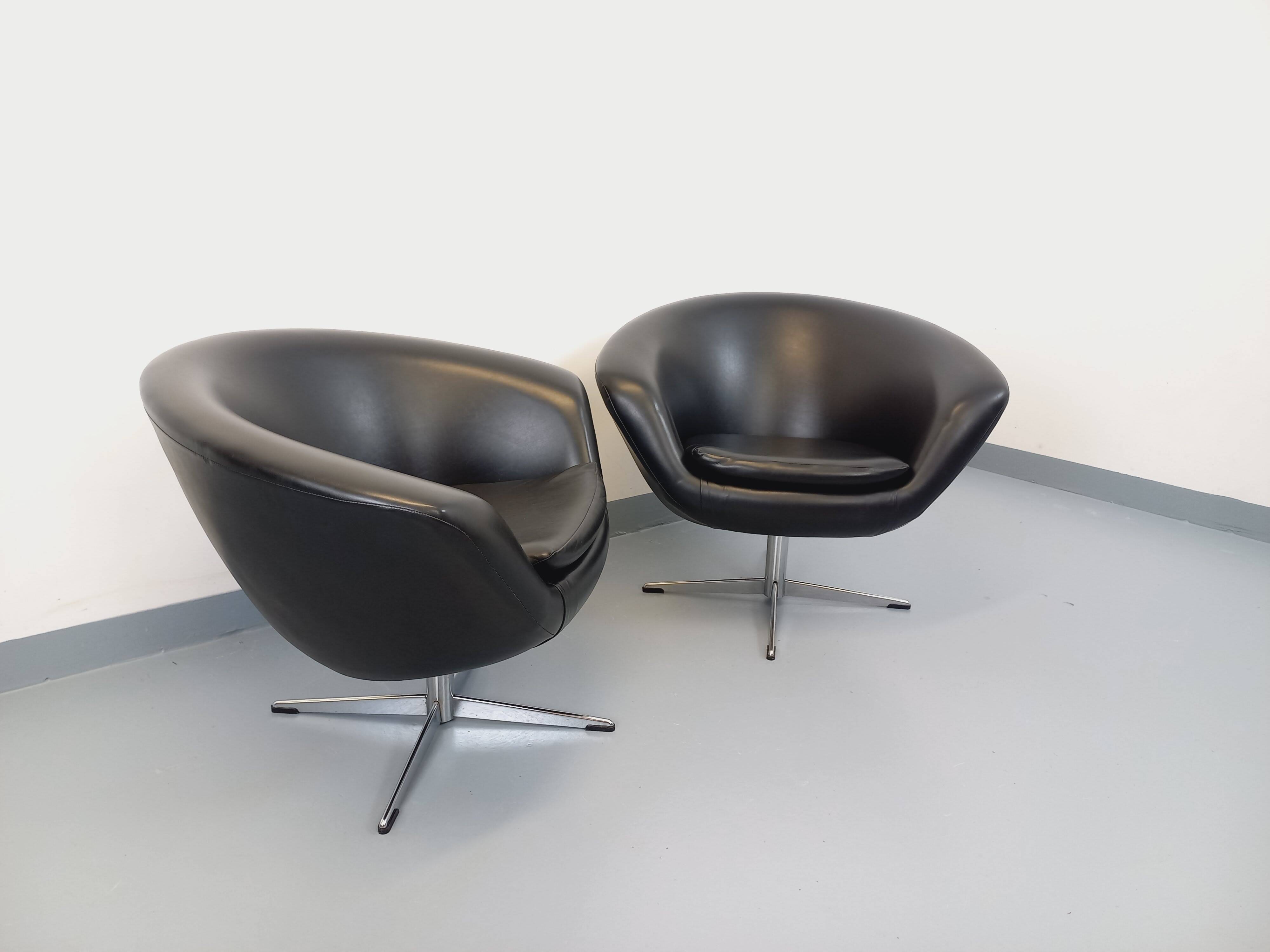 Pair of vintage Scandinavian swivel armchairs in faux leather and chrome.