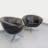 Pair of vintage Scandinavian swivel armchairs in faux leather and chrome.