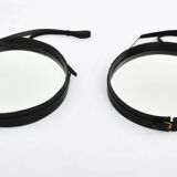 Jacques Adnet pair of circular leather and brass mirrors