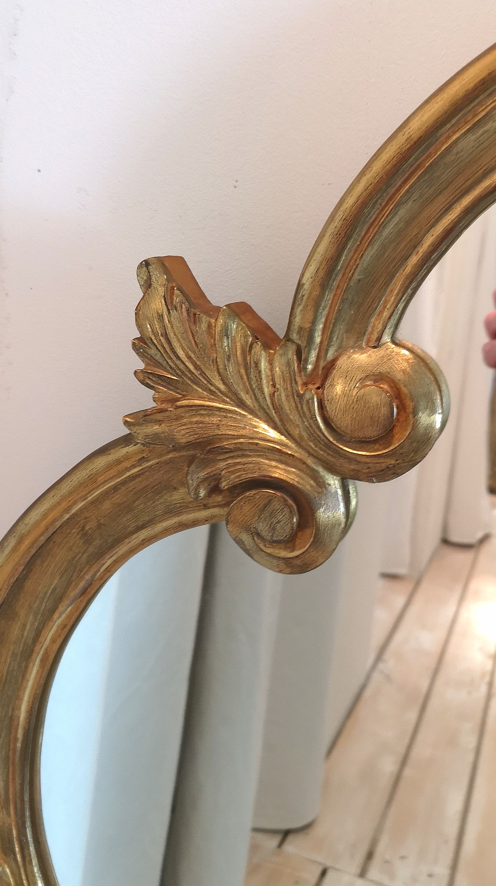 Elongated oval baroque gilded mirror