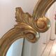 Miroir doré baroque ovale allongé