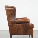 Large sheep leather wingback chair correctly finished with decorative nails