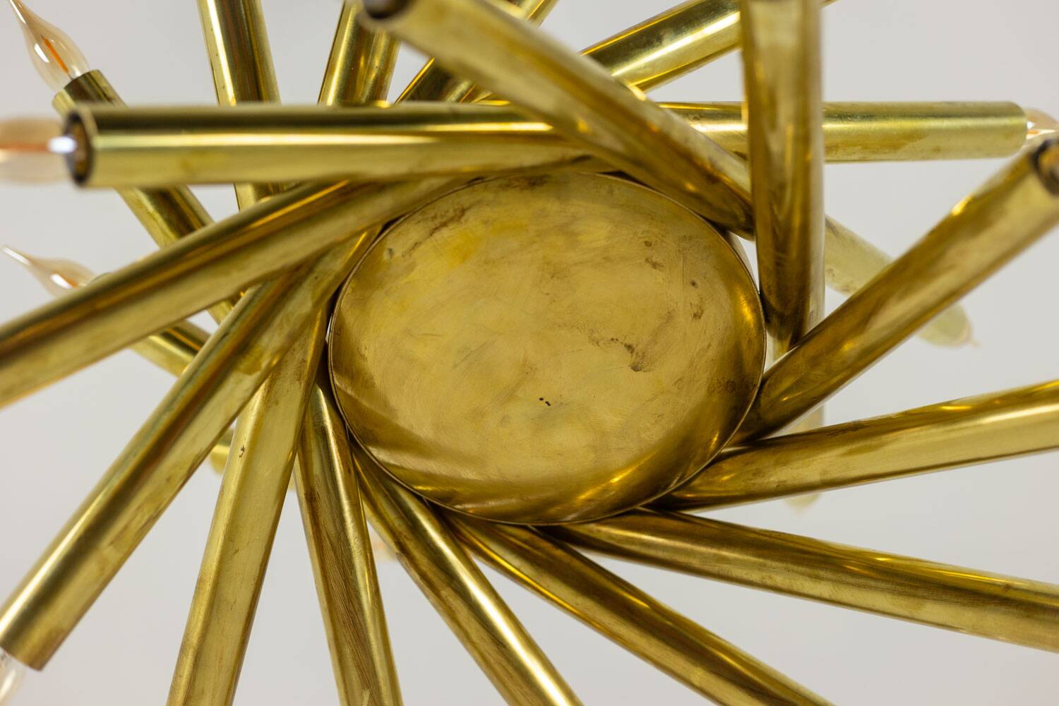 Pair of 24-light patinated brass chandeliers. 1980s.