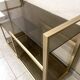 Console / étagère vintage en laiton doré et verre fumé des années 50