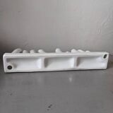 set of decorative vases composed of 11 white ceramic soliflores, evoking the delicate appearance of coral. In good general condition, despite some chips. Dimensions: 29.5 * 5.2 * 11.5 cm.