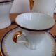 Coffee pot, sugar pot, 1 cup and saucer.