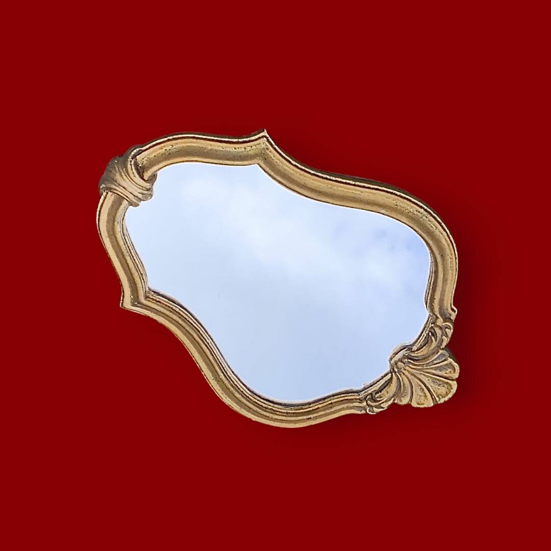 Small vintage rockery wall mirror in golden resin