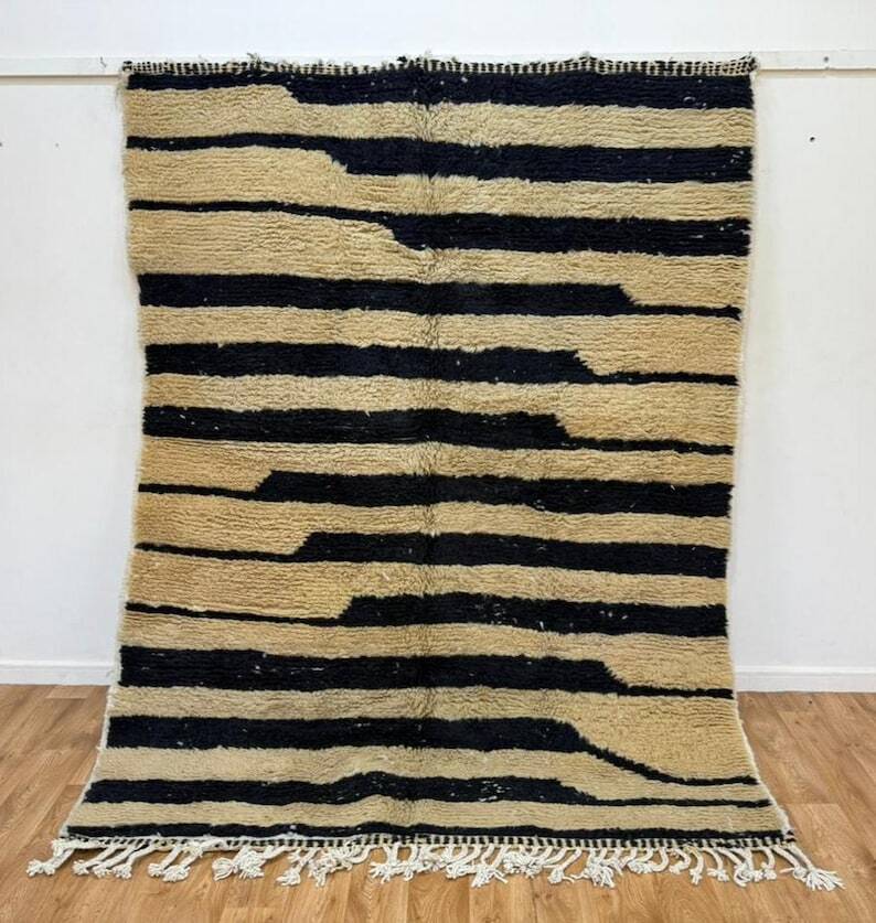 Handmade Moroccan rug in ecru with coloured patterns, 250cm x 150cm.