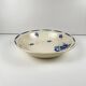 Half-porcelain salad bowl from Badonviller, blue flower pattern, early 20th century.