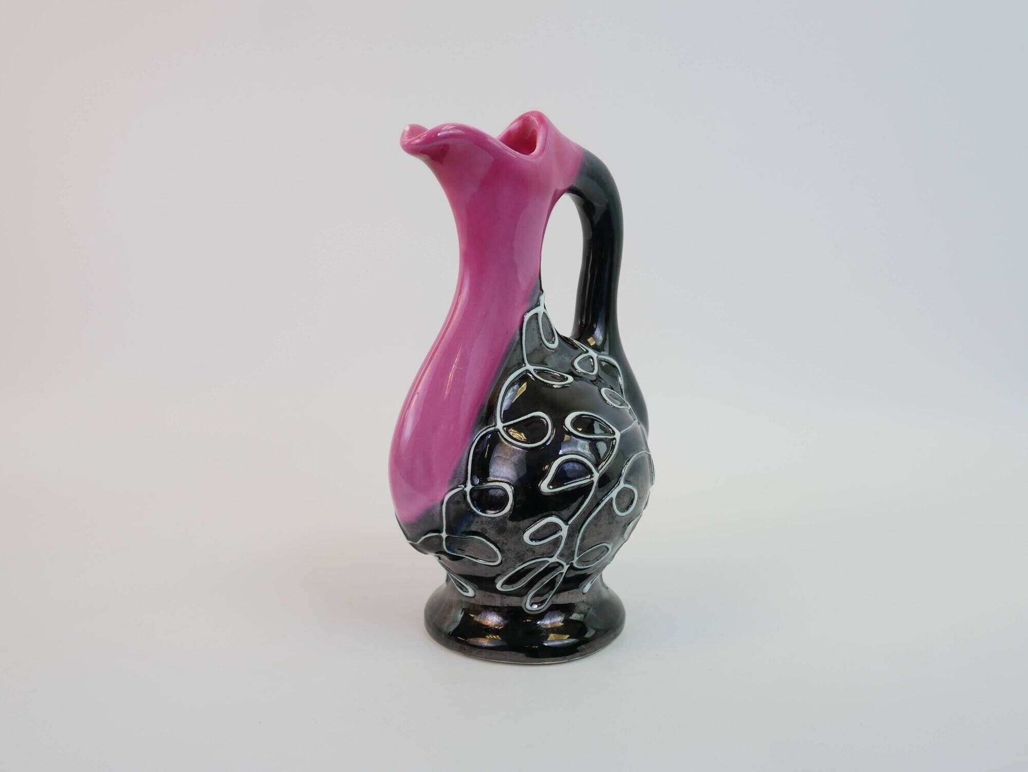 Black and pink Vallauris carafe with white relief patterns