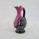 Black and pink Vallauris carafe with white relief patterns