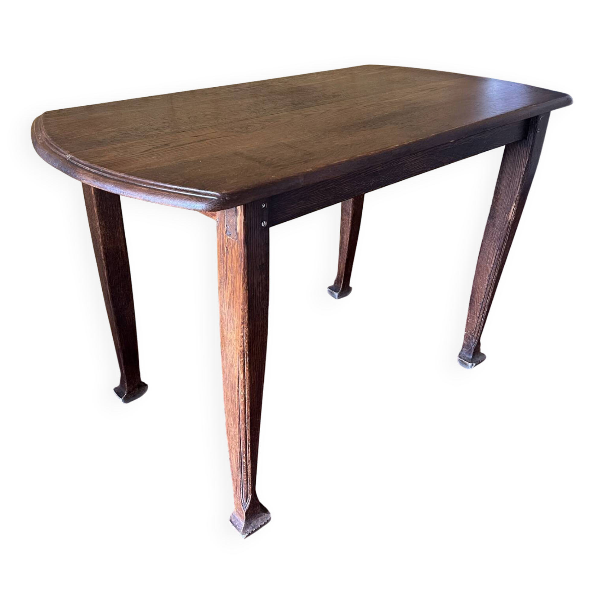 Vintage antique oak table with ornate legs.