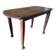 Vintage antique oak table with ornate legs.
